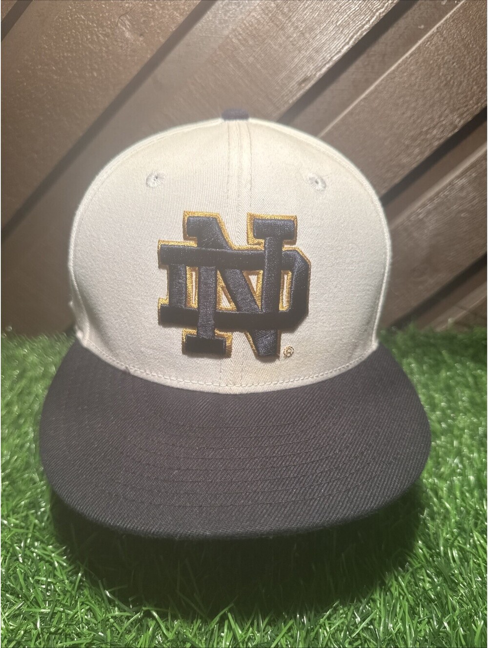 New Era 9FIFTY Notre Dame Fighting Irish Snapback Hat Cream Navy Leprechaun Side